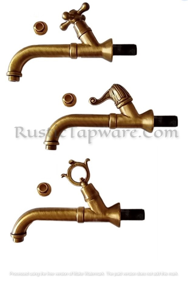 Long ornated water tap with cross handle in polished bronze finish