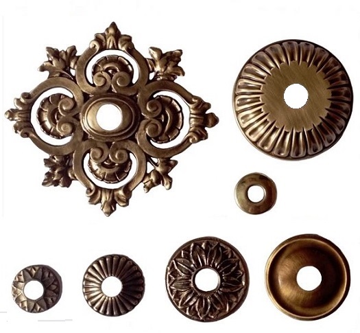 Decorative backplates and escutcheons for water taps and fountain spouts