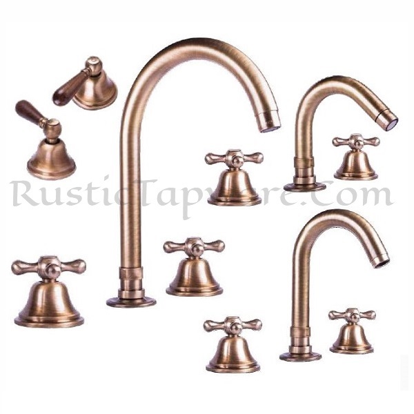 Deck mounted three hole sink mixer water tap in antique style with wooden or classic handles